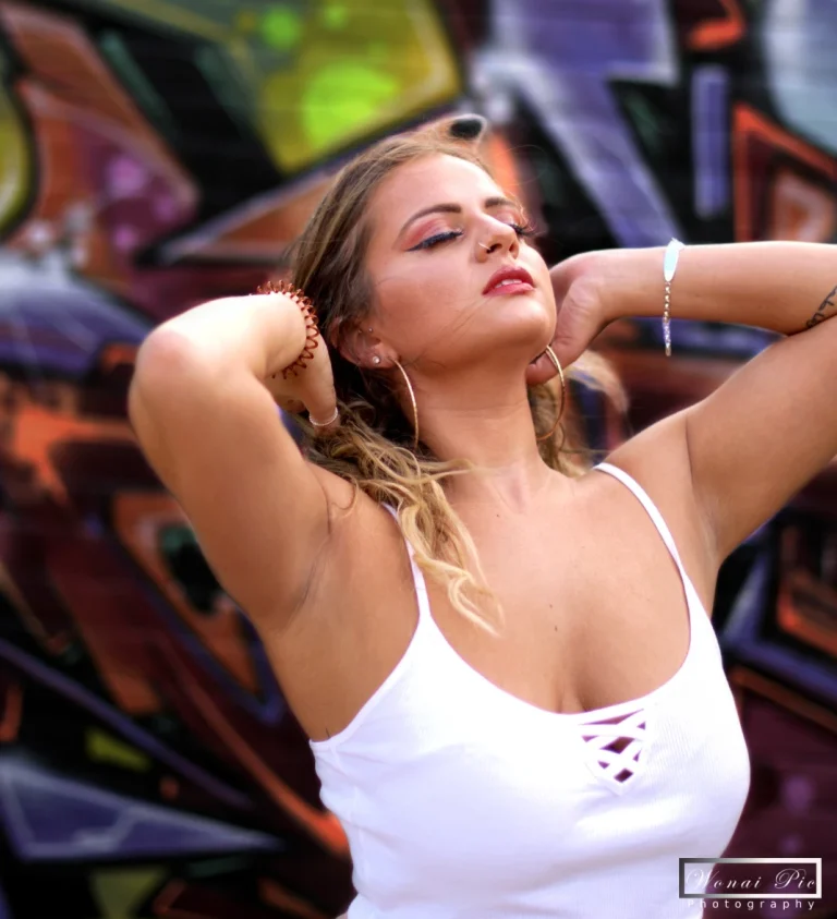 Sonnay getting a portrait picture whilst holding her hair